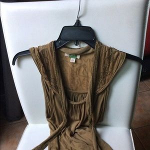 It’s a beautiful beaded top. Comfortable. Can be dressed up or down